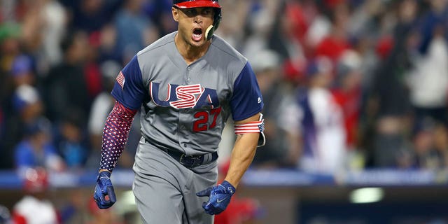 Giancarlo Stanton of Team USA celebrates after hitting a two-run home run in the top of the fourth inning of Game 6 of Group F of the 2017 World Baseball Classic against the Dominican Republic on March 18, 2017 at Petco Park in San Diego.