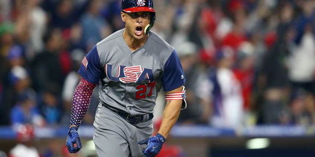 Giancarlo Stanton of Team USA celebrates after hitting a two-run home run in the top of the fourth inning of Game 6 of Group F of the 2017 World Baseball Classic against the Dominican Republic on March 18, 2017 at Petco Park in San Diego.