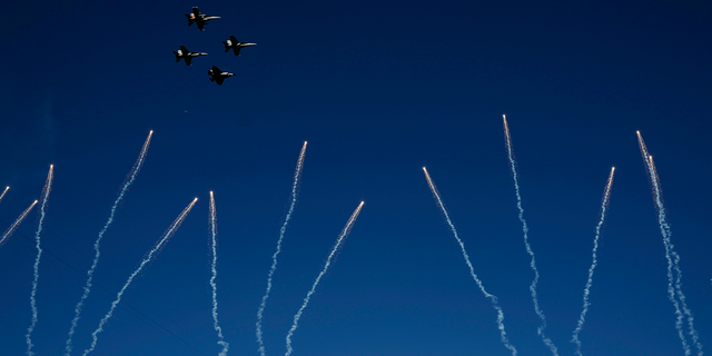 Navy pilots perform a flyover before Super Bowl LVII at State Farm Stadium on Feb. 12, 2023, in Glendale, Arizona.