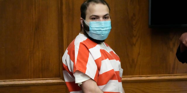 Ahmad Al Aliwi Alissa, accused of killing 10 people at a Colorado supermarket, is led into a courtroom on Sept. 7, 2021. Ahmad Al Aliwi Alissa has been diagnosed with schizophrenia.