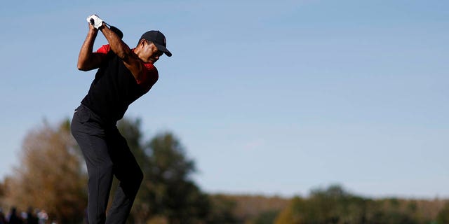 Tiger Woods of the United States plays his shot from the first tee during the final round of the PNC Championship at the Ritz-Carlton Golf Club on December 18, 2022 in Orlando, Florida. 