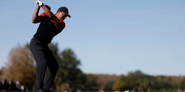 Tiger Woods of the United States plays his shot from the first tee during the final round of the PNC Championship at Ritz-Carlton Golf Club on December 18, 2022 in Orlando, Florida.