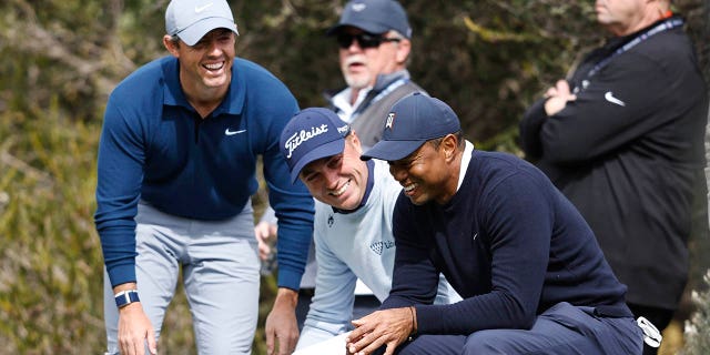 (L-R) Rory McIlroy of Northern Ireland, Justin Thomas of the United States and Tiger Woods of the United States meet on the fourth tee during the first round of the Genesis Invitational at Riviera Country Club on February 16, 2023, in Pacific Palisades, California.