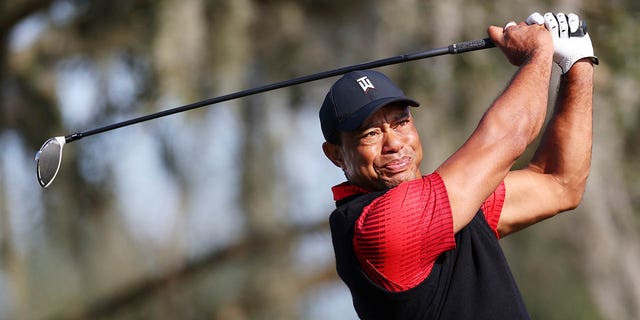 Tiger Woods of the United States plays his shot from the tenth tee during the final round of the PNC Championship at Ritz-Carlton Golf Club on December 18, 2022 in Orlando, Florida.