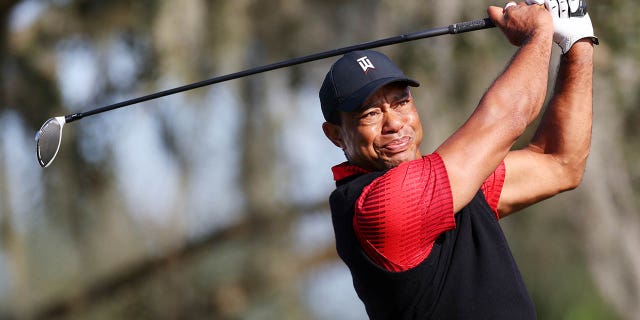 Tiger Woods of the United States plays his shot from the tenth tee during the final round of the PNC Championship at Ritz-Carlton Golf Club on December 18, 2022 in Orlando, Florida.