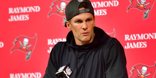 Tom Brady #12 of the Tampa Bay Buccaneers speaks to the media after losing to the Dallas Cowboys 31-14 in the NFC Wild Card playoff game at Raymond James Stadium on January 16, 2023 in Tampa, Florida. 