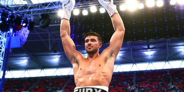 Tommy Fury is victorious as he defeats Daniel Bocianski during their light heavyweight fight at Wembley Stadium on April 23, 2022 in London, England