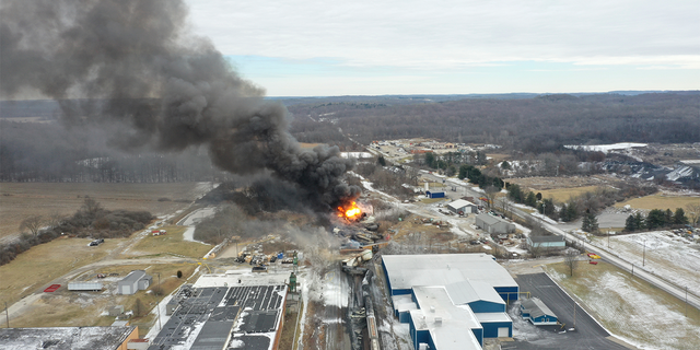 A train derailment and resulting large fire prompted an evacuation order in the Ohio village near the Pennsylvania state line on Friday night,