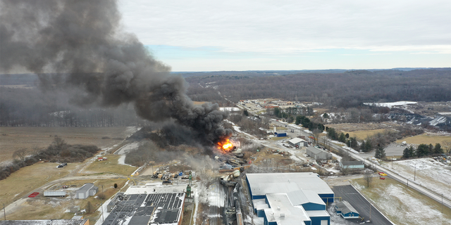 A train derailment and resulting large fire prompted an evacuation order in the Ohio village near the Pennsylvania state line on Friday night,