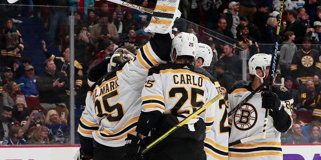 Linus Ullmark #35 of the Boston Bruins scores a goalie goal on a pulled net during the final seconds of their NHL game against the Vancouver Canucks at Rogers Arena February 25, 2023, in Vancouver, British Columbia, Canada. The Boston Bruins win 3-1.