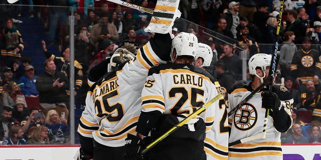 Linus Ullmark #35 of the Boston Bruins scores a goalie goal off a dropped net during the final seconds of their NHL game against the Vancouver Canucks at Rogers Arena on February 25, 2023 in Vancouver, British Columbia, Canada.  The Boston Bruins win 3-1.   