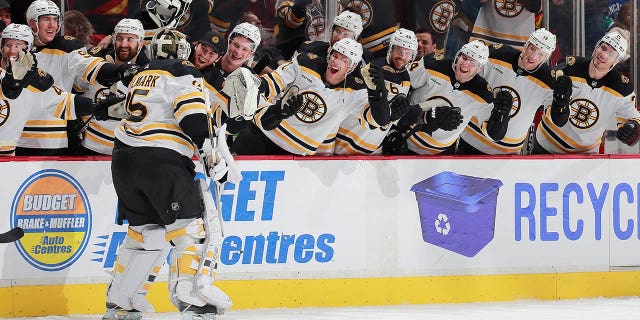 Linus Ullmark #35 of the Boston Bruins scores a goalie goal on a pulled net during the final seconds of their NHL game against the Vancouver Canucks at Rogers Arena February 25, 2023, in Vancouver, British Columbia, Canada. The Boston Bruins win 3-1.