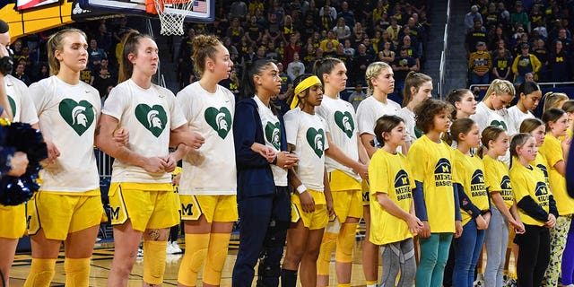 Michigan Wolverines women's basketball players are seen wearing special jerseys in support of Michigan State University before a college basketball game against the Ohio State Buckeyes at Crisler Arena on February 20, 2023 in Ann Arbor, Michigan.  The Michigan Wolverines paid tribute to the students who were killed or affected by a mass shooting at Michigan State University the previous week.