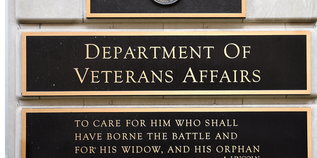  A metal plaque on the facade of the Department of Veterans Affairs building in Washington, D.C., features a quotation by former President Lincoln.