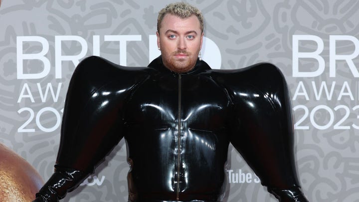 Sam Smith makes a bold fashion statement in a inflatable black latex ...