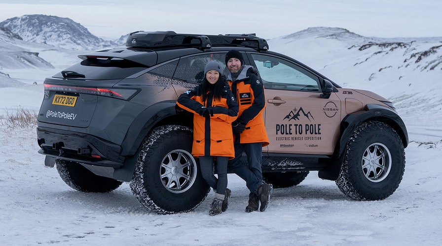 Married couple driving from North Pole to South Pole