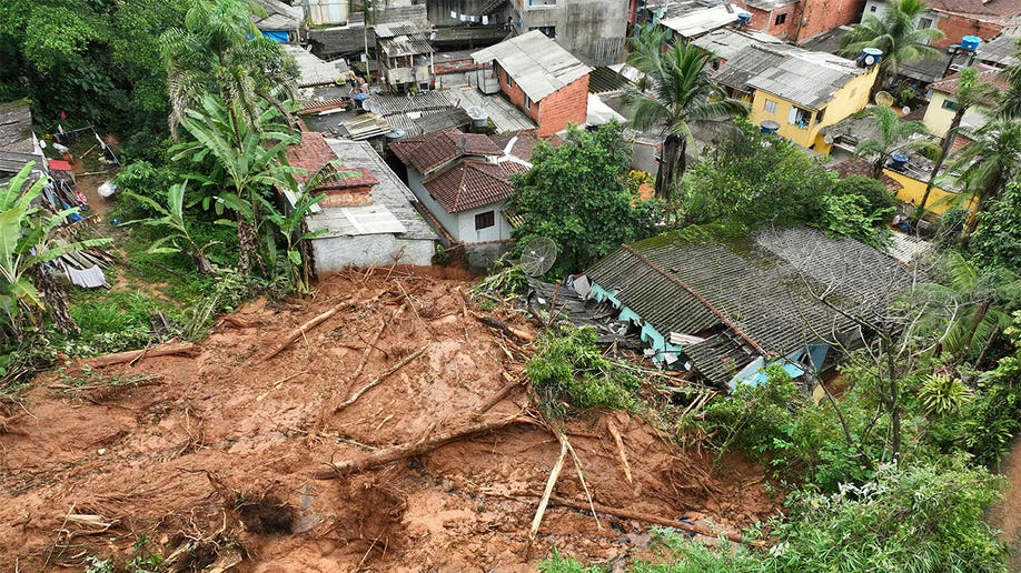 Arial view of mud spilling into town after a mudslide.