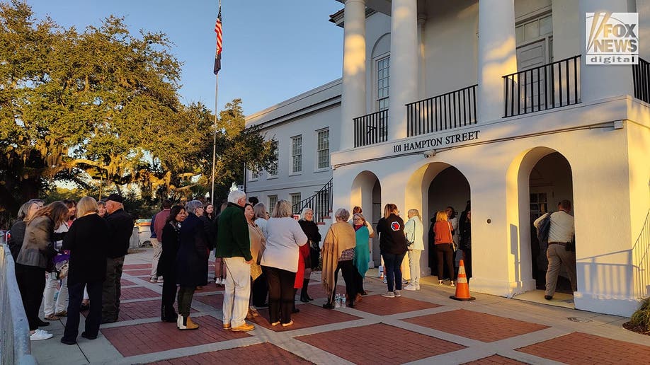 A line of about 20 people outside the courthouse