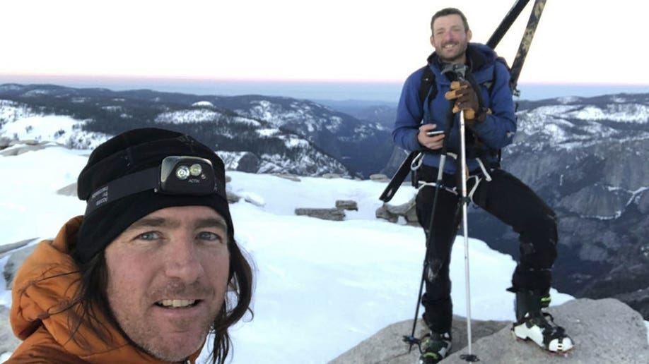 Jason Torlano smiles while skiing