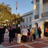 Spectators line up early outside the Colleton County courthouse, seeking a seat inside the courtroom to witness the trial.