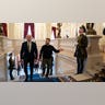 President Joe Biden and Ukrainian President Volodymyr Zelenskyy walk up stairs inside Mariinsky Palace.