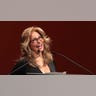 Raquel Welch smiling while giving a speech