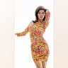 Raquel Welch posing in a tie dye dress