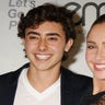 Hayden Panettiere beams on the red carpet wearing a black lace outfit next to younger brother Jansen in a white v-neck shirt and black suit