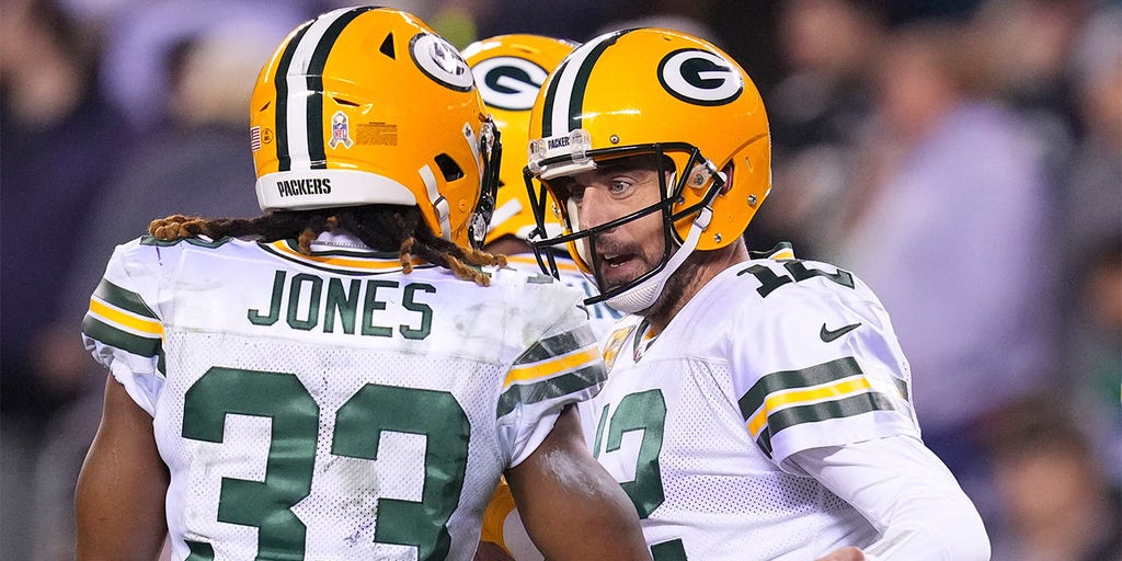 Aaron Jones of the Green Bay Packers celebrates with his teammates News  Photo - Getty Images