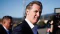 California Gov. Gavin Newsom heads to a press conference in Half Moon Bay, Calif., on Jan. 24, 2023.