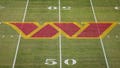 A general view of the Washington Commanders logo on the field before the game between the Washington Commanders and the Cleveland Browns at FedExField on January 1, 2023 in Landover, Maryland.