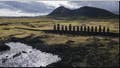 Moai statues stand on Ahu Tongariki near the Rano Raraku volcano, top, on Rapa Nui, or Easter Island, Chile, Nov. 27, 2022. According to Salvador Atan Hito, vice president of the Ma'u Henua Indigenous community which administers the archaeological treasure of Rapa Nui, on March 1, 2023, a small moai was discovered recently in the middle of a dry lagoon inside the volcano's crater.