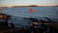 Children play along the Delaware River where a stop sign has been placed in the water at Penn Treaty Park in Philadelphia, Pa., on March 26, 2023. Water in Philadelphia has been deemed unsafe to drink following a chemical spill in the Delaware River, leading to water bottles being sold out across the city.
