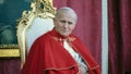 11/2/1982- Avila, Spain: Close-up of Pope John Paul II sitting on a chair, wearing red robes with a portrait of the St. Theresa of Avila in the background during his visit to Avila, Spain. - Fox News