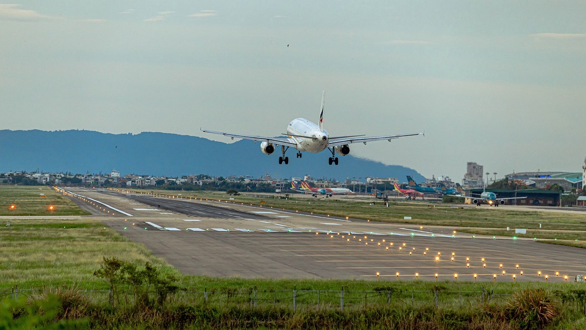 Airplane taking off from tarmac during daytime