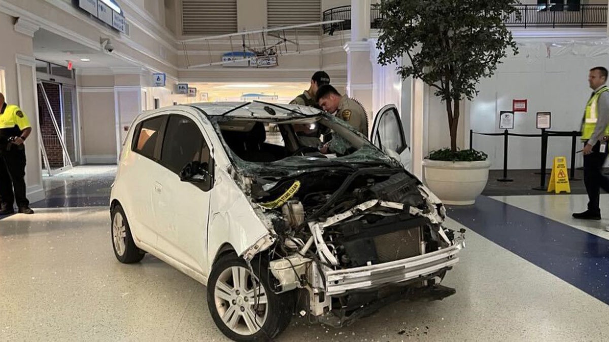 North Carolina man crashes compact car through airport doors and windows