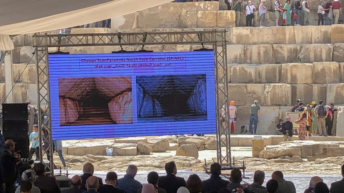 Photos are seen at news conference at Great Pyramid of Giza, Egypt