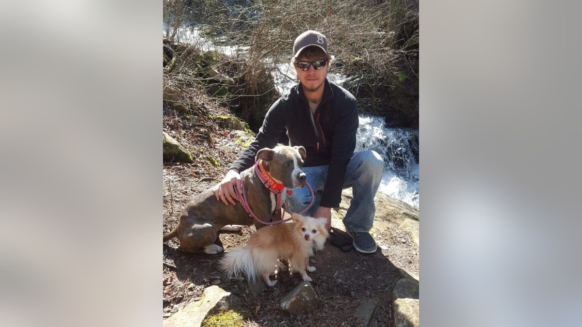 Harley McCourt poses with two dogs