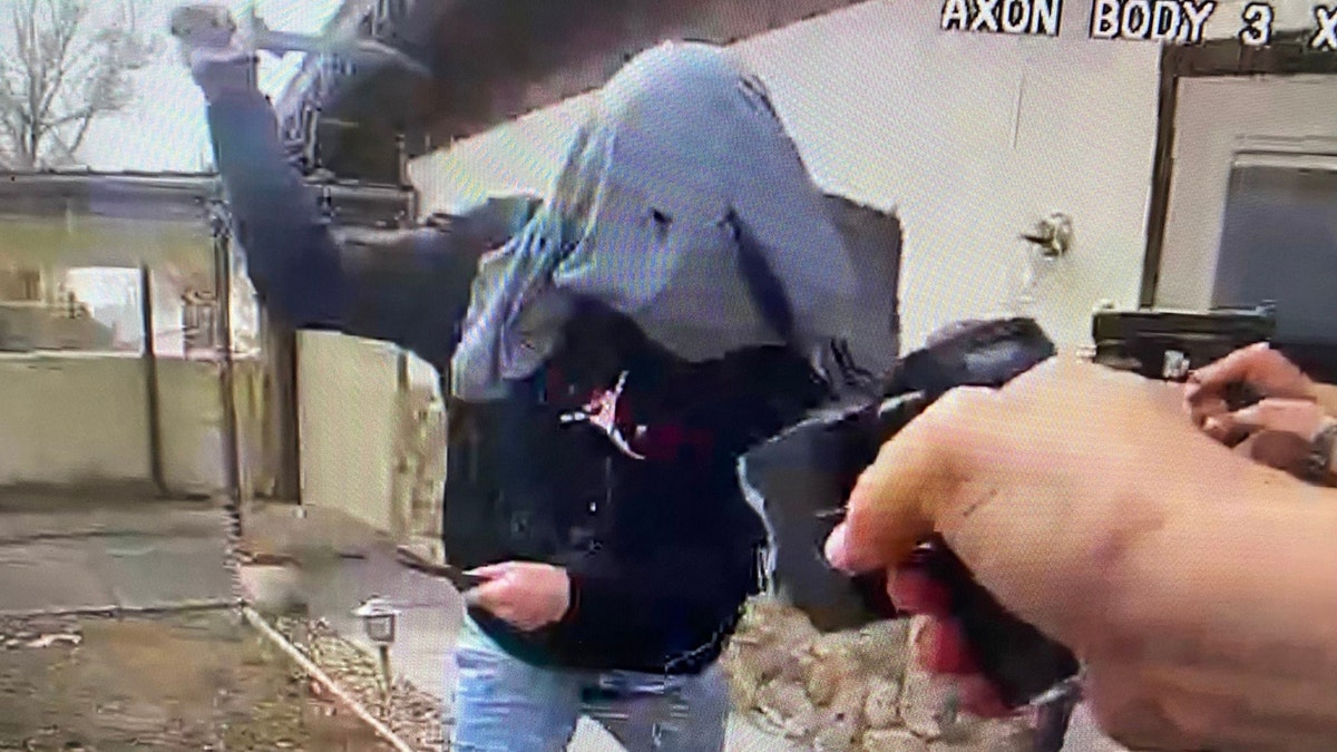 A man holding two knives