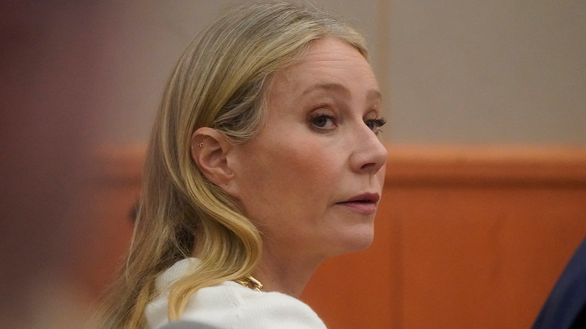 Gwyneth Paltrow day 2 in court in Utah with a white shirt on turns her head to the right