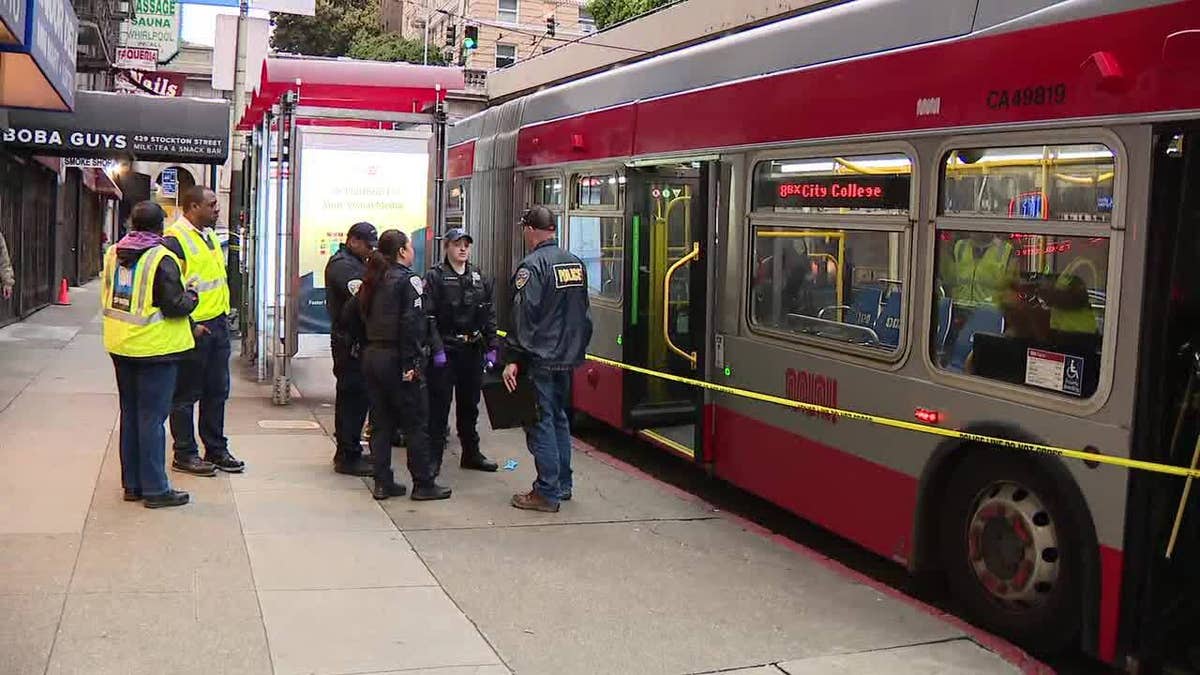 Police standing outside bus crime scene