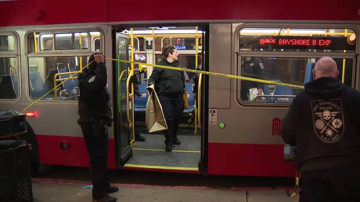 Yellow tape covering Muni bus