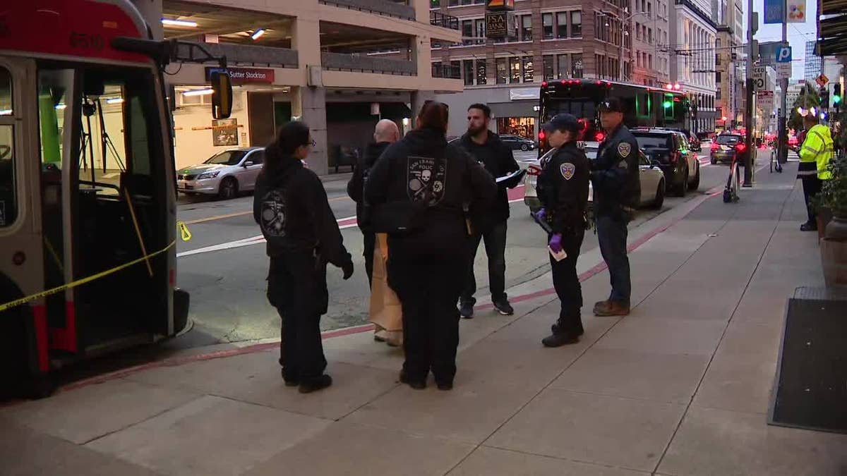 SF police officers talking to each other