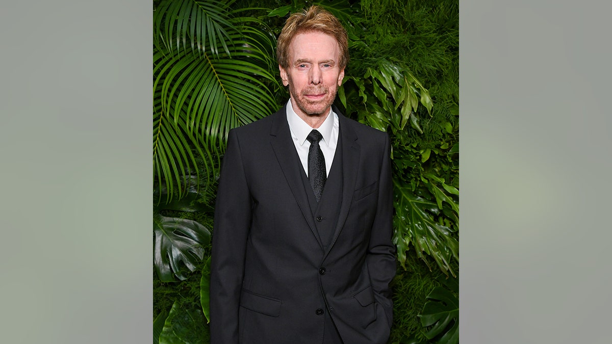 Jerry Bruckheimer in a black suit and tie at the Chanel and Charles Finch dinner