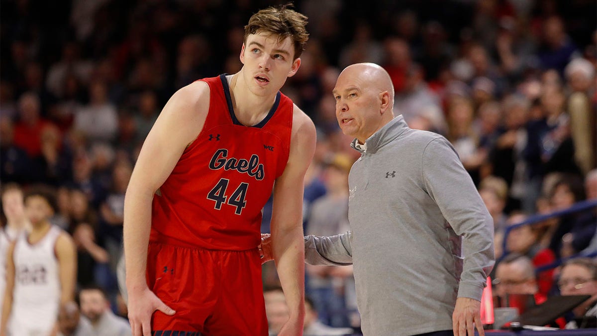 Randy Bennett talks to his player