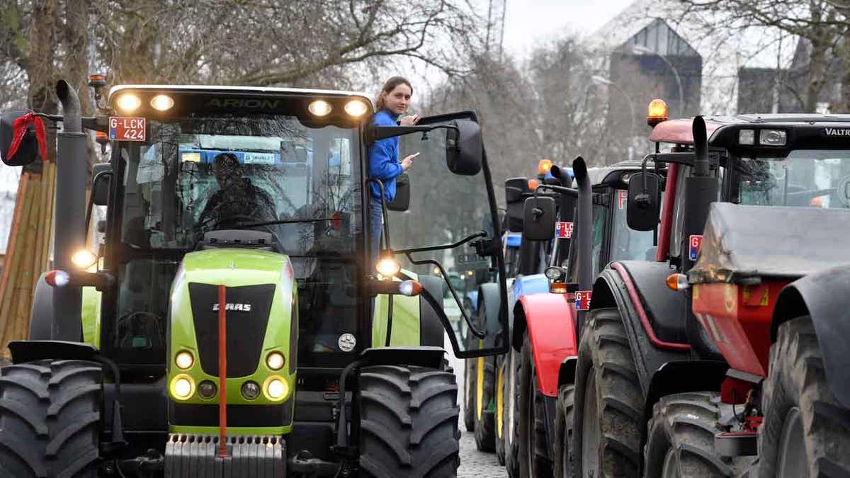 Farmers with their tractors in the road