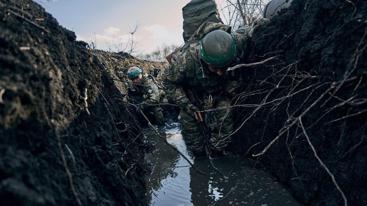 Ukrainian soldiers hunker down in Bakhmut trench