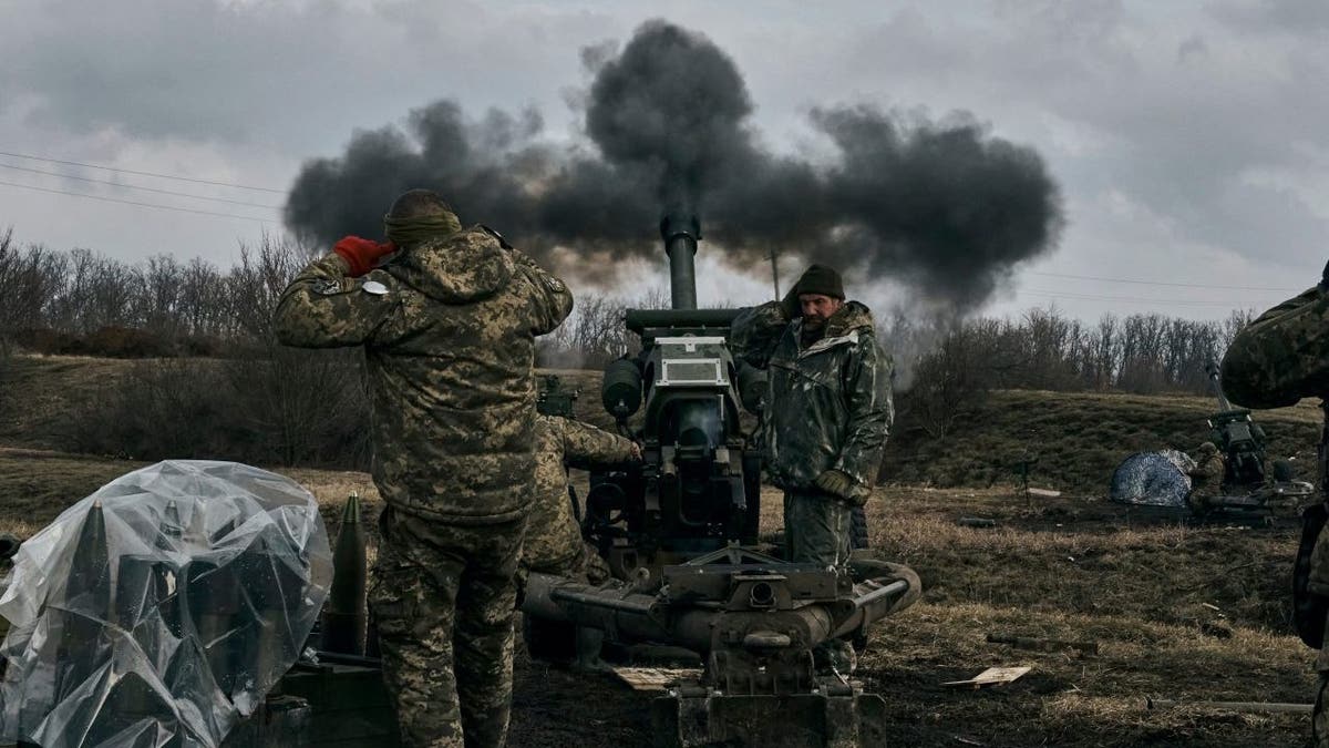 men firing artillery near Bakhmut, Ukraine