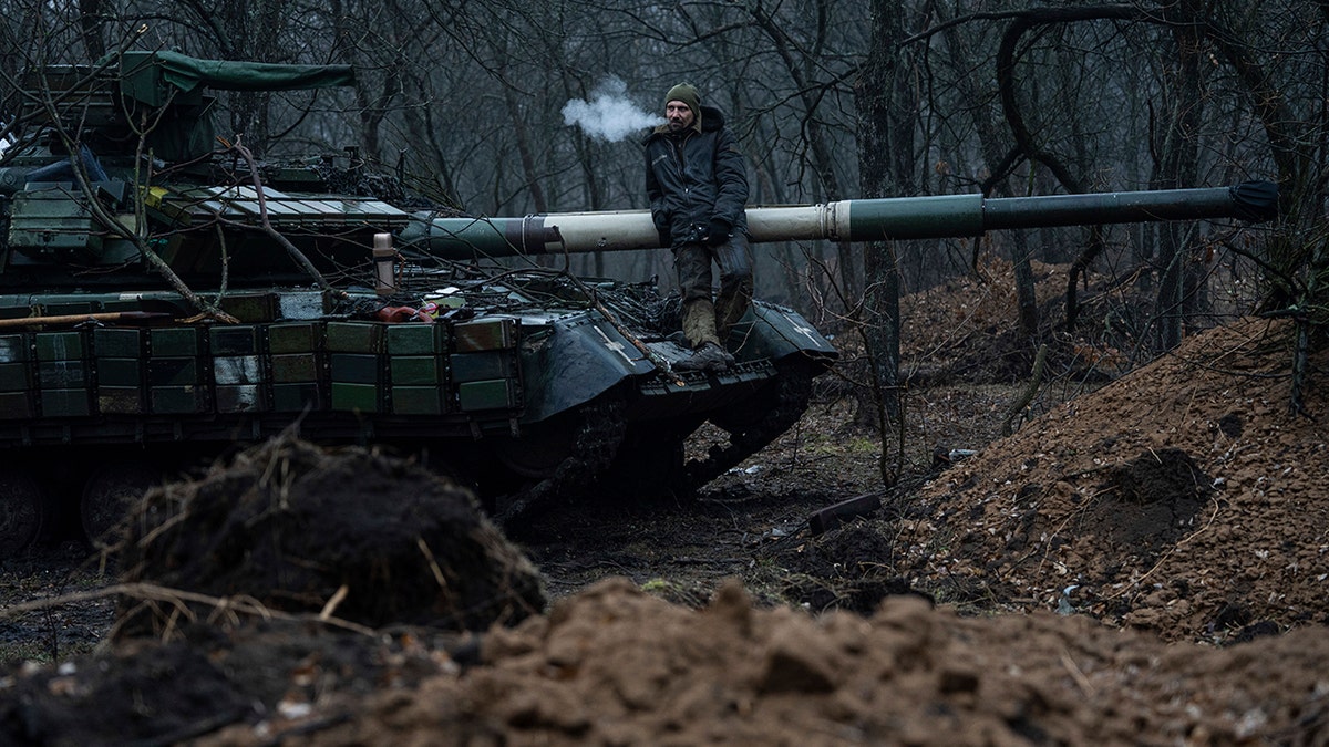 A Ukrainian soldier and a tank