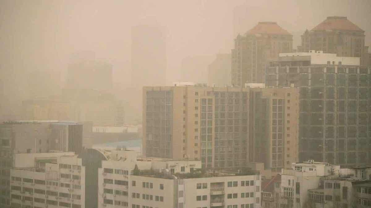 Haze and dust envelops buildings in Beijing